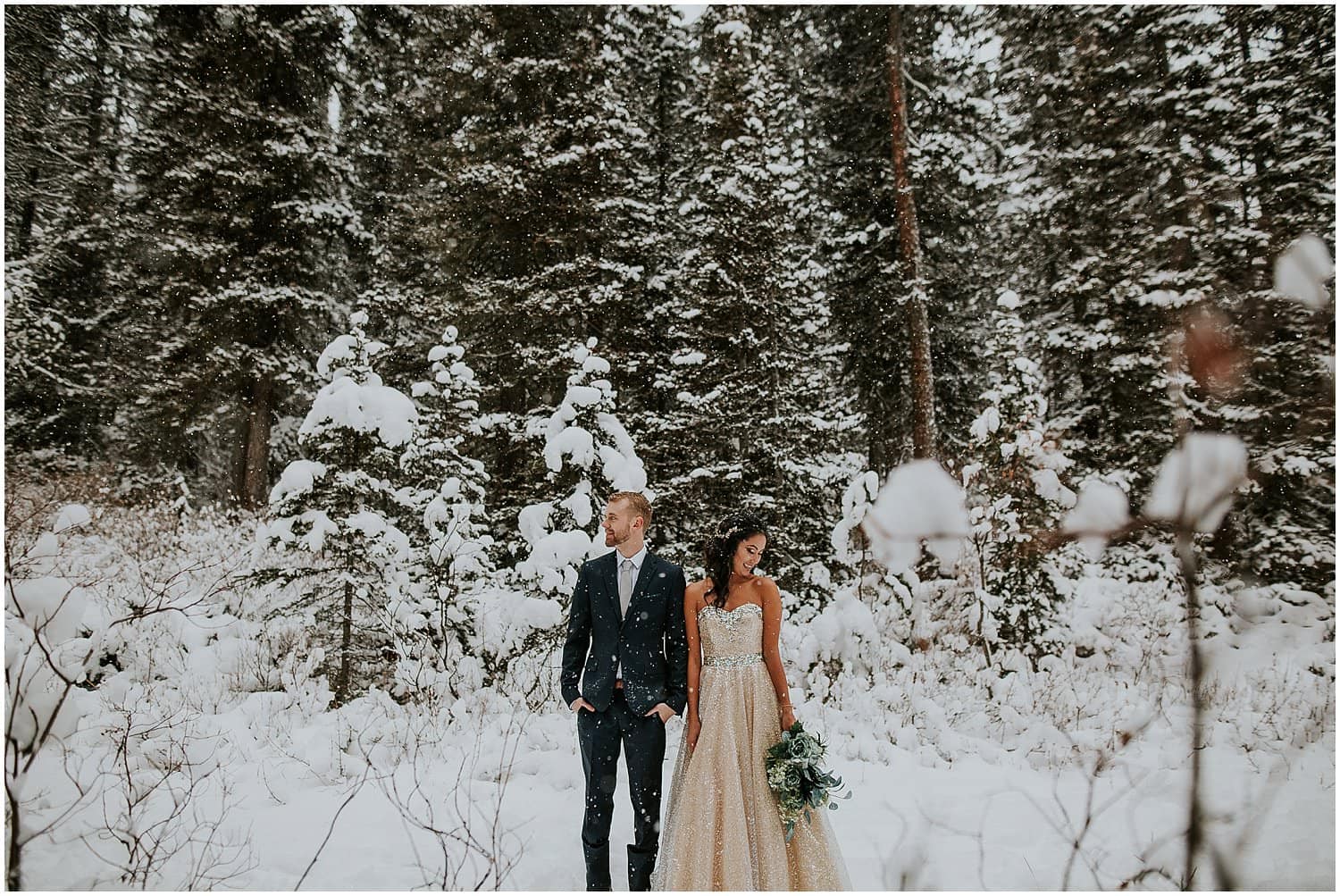 Elope in Banff. Bride and Groom during portraits at Storm Mountain Lodge. Winter elopement. Banff Elopement Photographer. 