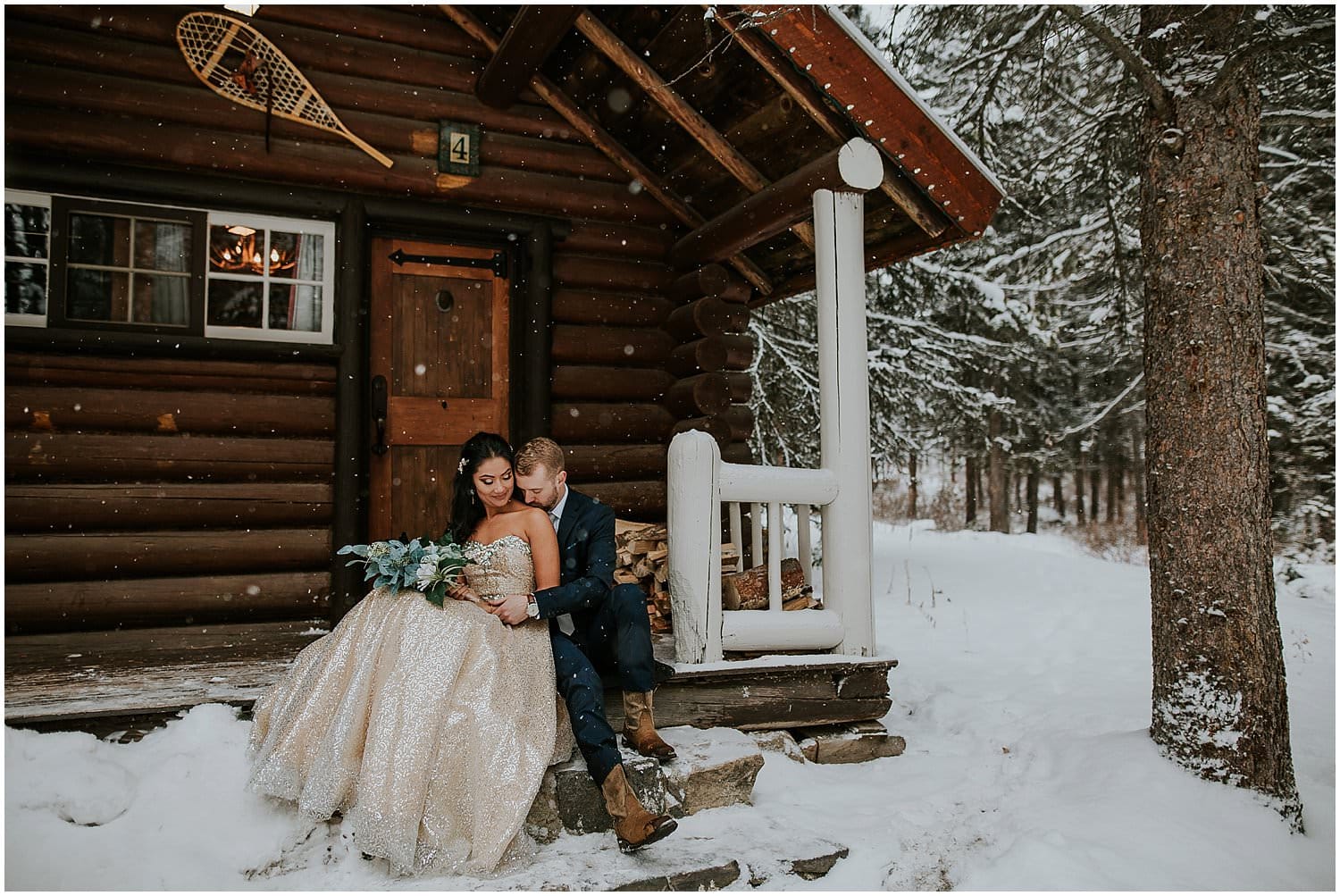 Bride and groom cuddling outside of their cabin at Storm Mountain Lodge during their Banff elopement. 