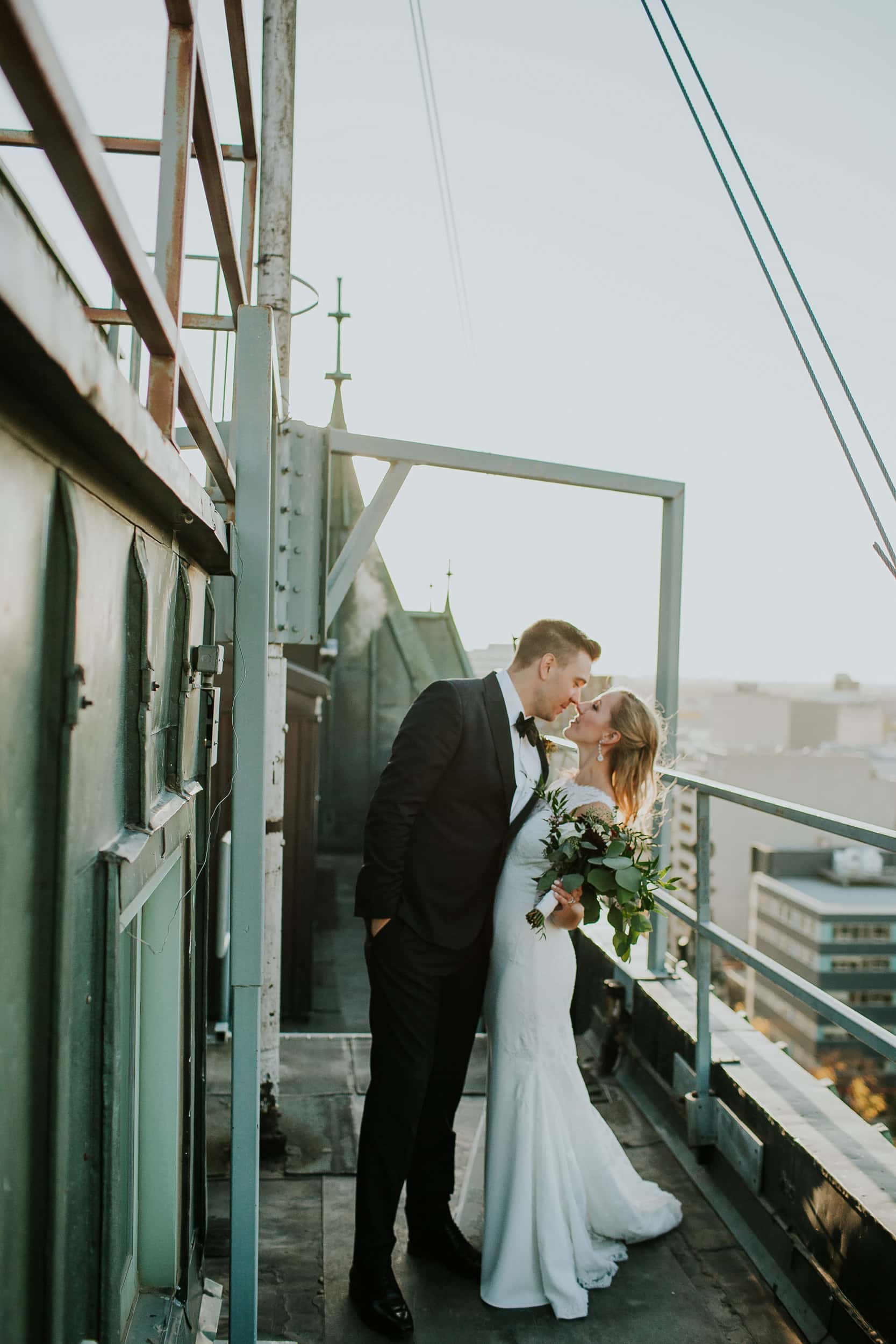wedding couple with city skyline behind